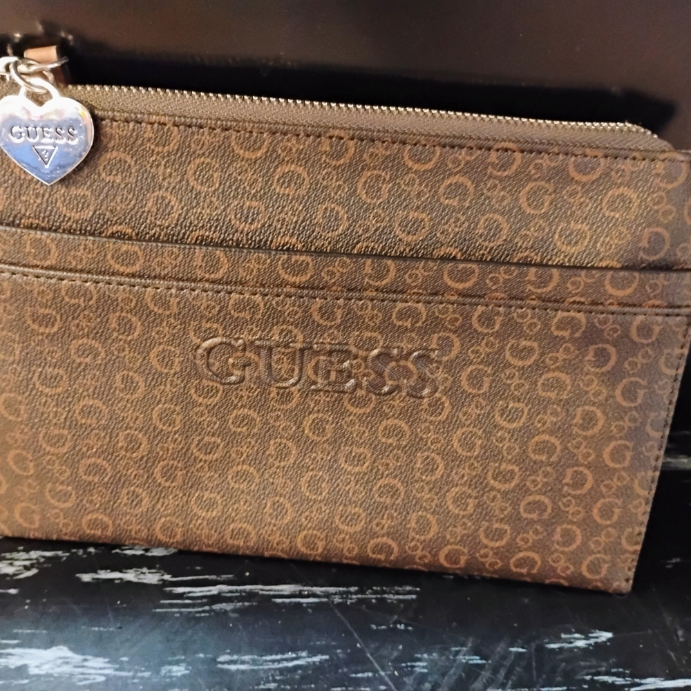 Guess Tan Monogram Clutch with Silver Charm